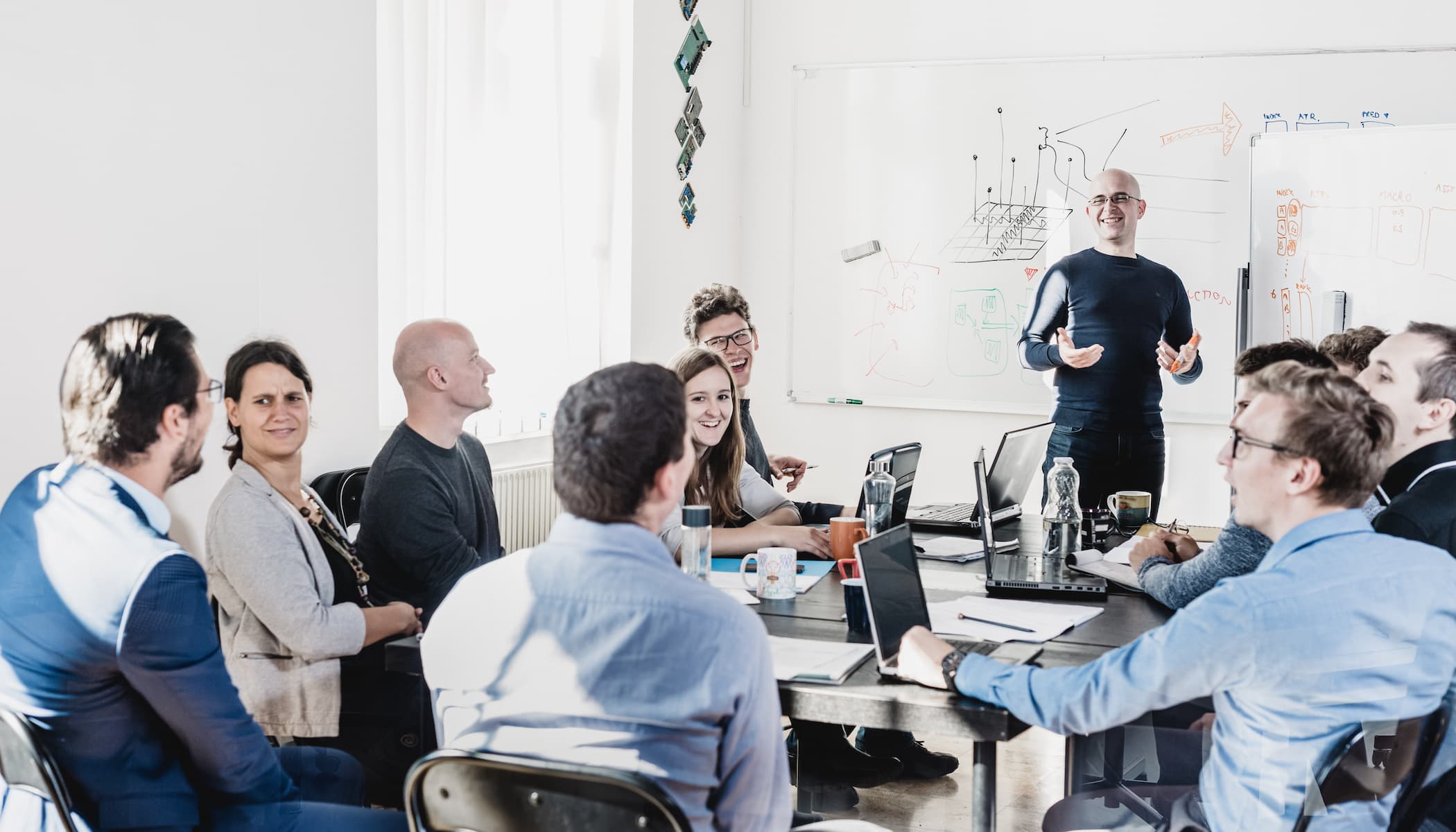 Diverse group of business people in a branding meeting with a facilitator